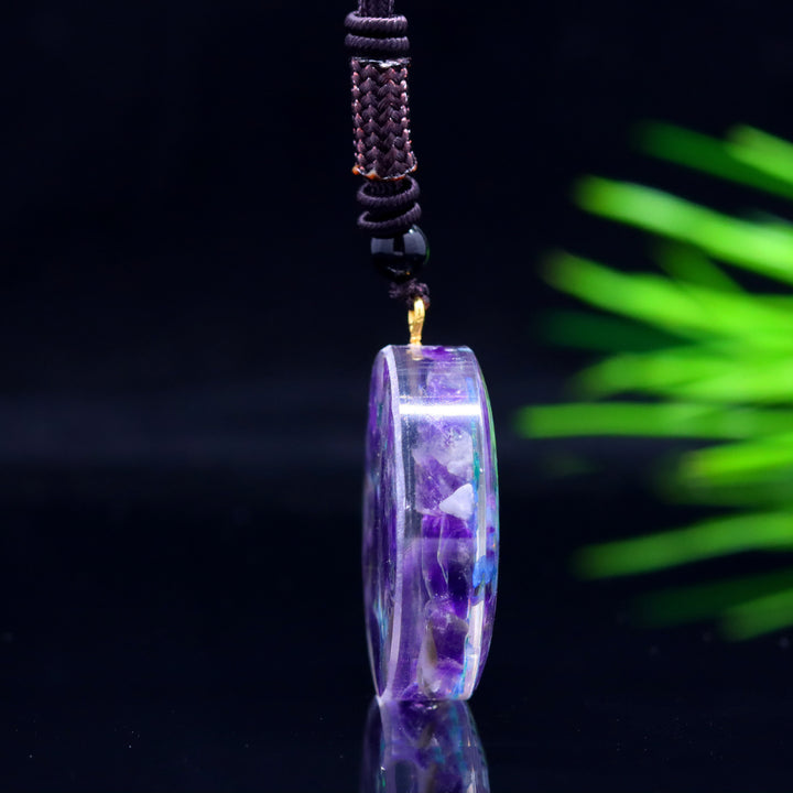 Pendentif “Triskel Celtique” en Améthyste Naturelle